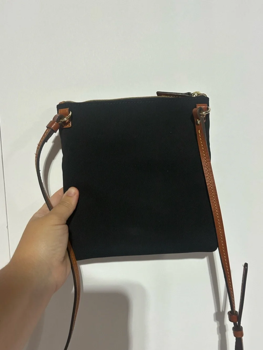 Dooney & Bourke North South Triple Zip Black Crossbody with Brown Leather Strap